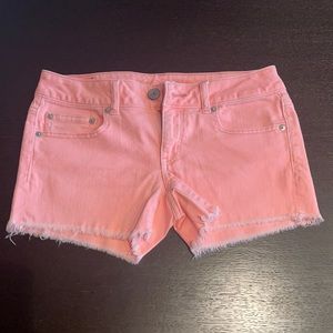 Bright melon colored shorts